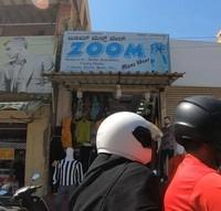 logo of Zoom Mens Wear